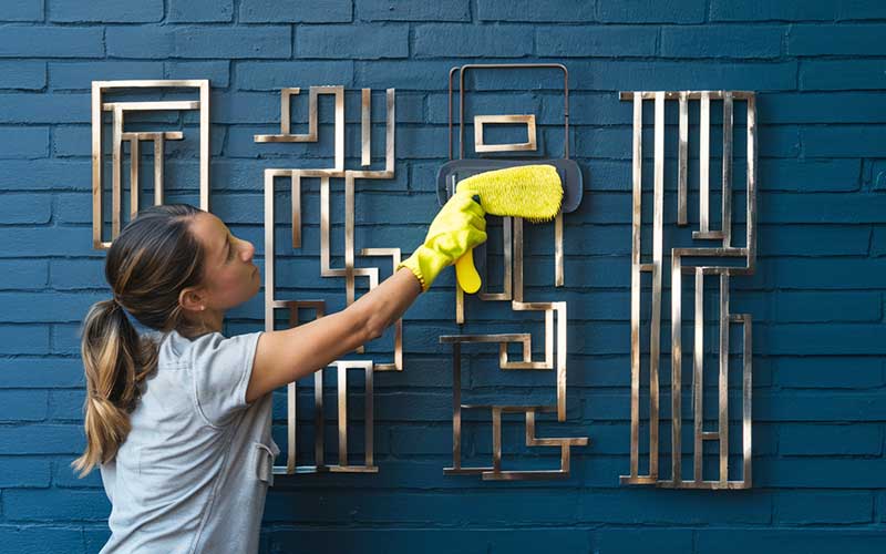 Removing dust and light dirt from metal wall art