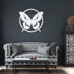 White minimalist circled butterfly wall art in living room