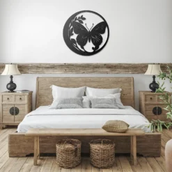 Black circled butterfly and foliage metal art showcase in bedroom