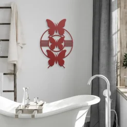 Red butterfly silhouette steel wall art display in bathroom