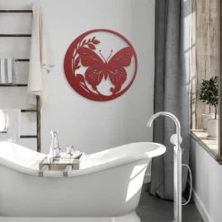 Red circled butterfly and foliage metal art showcase in bathroom