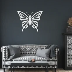 White abstract butterfly metallic wall hanging decor display in dark living room