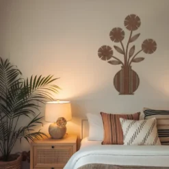 Brown/ copper flower vase artwork on a bedroom with brown color scheme