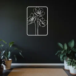 White single metallic flower art on dark hallway