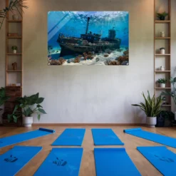 Blue themed yoga room with calm ocean depths wall art