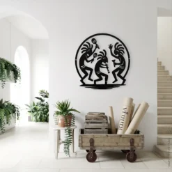 Black metal Kokopelli dance wall hanging indoor entryway