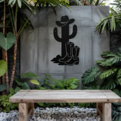 Black metal whimsical cowboy cactus exterior wall art