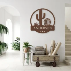 Brown metal cacti sign with custom typography: Entryway