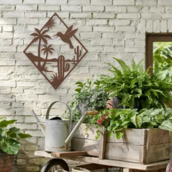 Brown powder coated steel desert oasis palms cacti outdoor wall art
