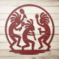 Red metal Kokopelli dance art