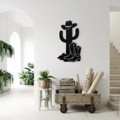 Whimsical cowboy cactus with boots and hat metal wall art indoor-entryway display
