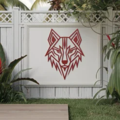 Red metallic geometric wolf head fence art exterior