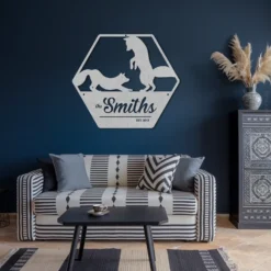 Silver metallic family name est date sign living room above couch