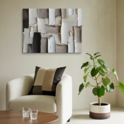 Neutral toned textured abstract wall decor lounge