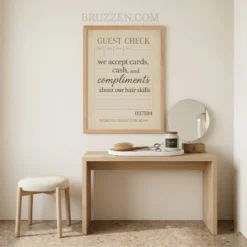 Close-up of a guest check style framed poster displayed in a classic barbershop setting near a leather styling chair.