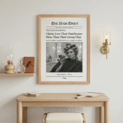 Chic beauty studio waiting area with a framed newspaper art piece displayed on a neutral wall next to a velvet chair.