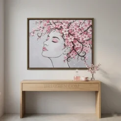 Pine-framed floral woman print displayed in a serene nail studio or lash bar with soft pink accents