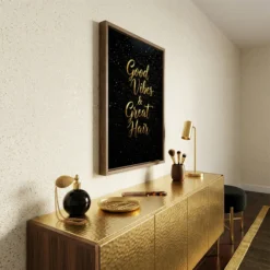 Side view of the Good Vibes and Great Hair canvas hang in vanity room showing the frame depth and print quality