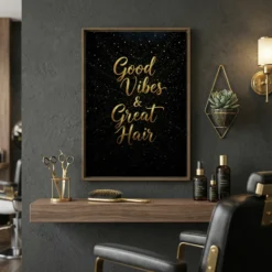Framed Good Vibes and Great Hair gold script canvas wall art hanging in a modern luxe hair salon