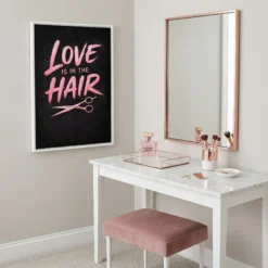 Pink and rose gold hair salon wall art displayed in a high-end glam vanity room with mirror