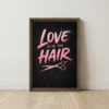 Love is in the Hair framed canvas art featuring pink lettering and rose gold shears on charcoal black