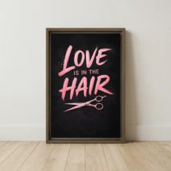 Love is in the Hair framed canvas art featuring pink lettering and rose gold shears on charcoal black