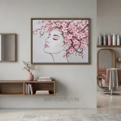 Framed cherry blossom woman artwork hanging on a neutral wall in a modern, bright beauty salon