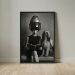 Black and white framed poster of a woman and an Afghan hound sitting under a vintage salon hair dryer.
