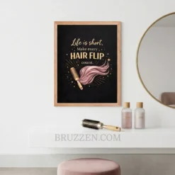 Professional hair salon interior with the pink and gold hair flip motivational art displayed near a styling station.