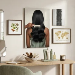 silky black hair comb glossy metal print styled on warm neutral minimalist gallery wall