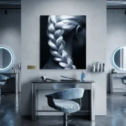 French braid silver hair glossy metal print hanging in modern braiding studio interior