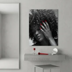 curly afro red nails portrait glossy metal print displayed in nail studio reception area