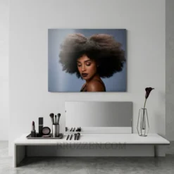 bold afro hair portrait metal print displayed on vanity room feature wall