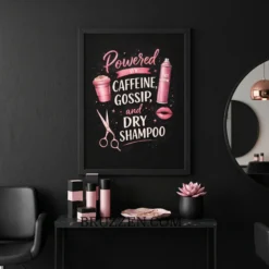 A pink salon typography poster hanging on a modern white wall above a professional hairstylist station with a mirror