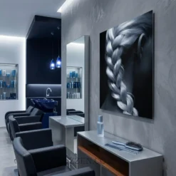 side angle view of French braid silver hair glossy metal print showing floating wall mount depth