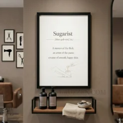 sugarist definition framed poster hanging on wall in soft modern sugaring treatment room