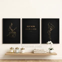 Black framed gold waxing art prints styled in a luxury esthetician treatment suite