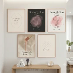 Waxing studio reception area with blush and charcoal feminine wall art prints in thin gold frames