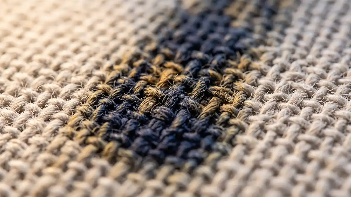 Close-up of canvas print texture showing the woven fiber surface that affects how wall art ages in humid rooms