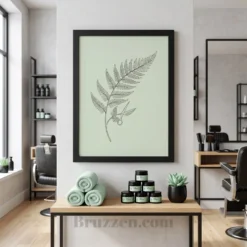 Fern scissors botanical framed poster in red oak frame displayed above styling station