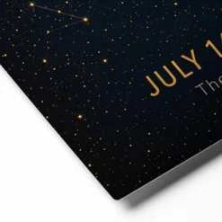 Close-up of memorial star map showing gold constellation lines and personalized inscription
